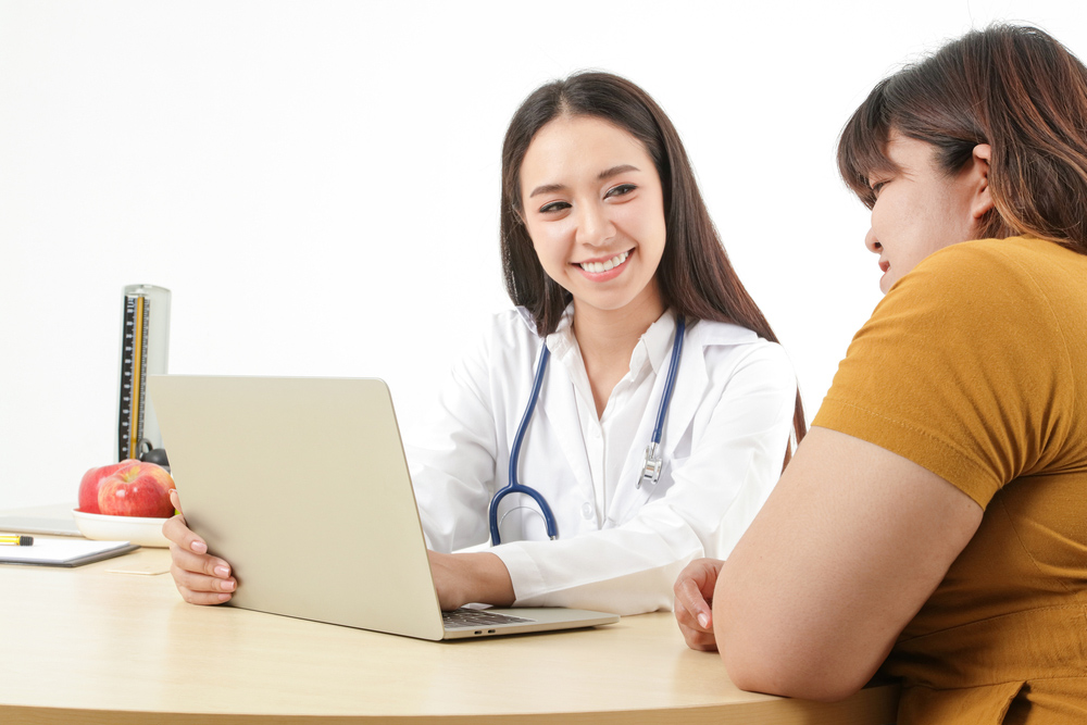 Healthcare provider discussing medical weight loss options and personalized weight management with a patient.