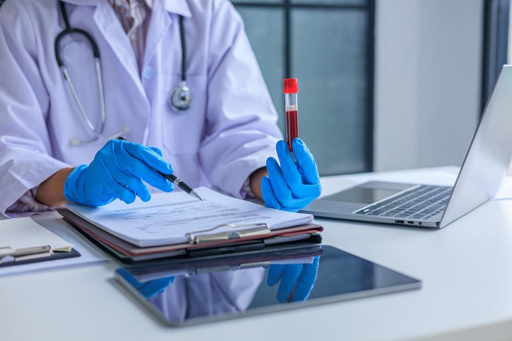 Healthcare provider discussing medical testing and referral options with a woman experiencing mood swings and brain fog