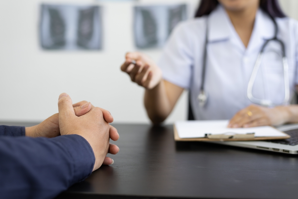 Healthcare provider discussing peptide therapy questions, treatment evidence, and follow-up care for mood swings and brain fog