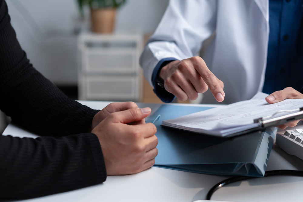 Healthcare provider reviewing sleep patterns and health history with a patient experiencing poor sleep
