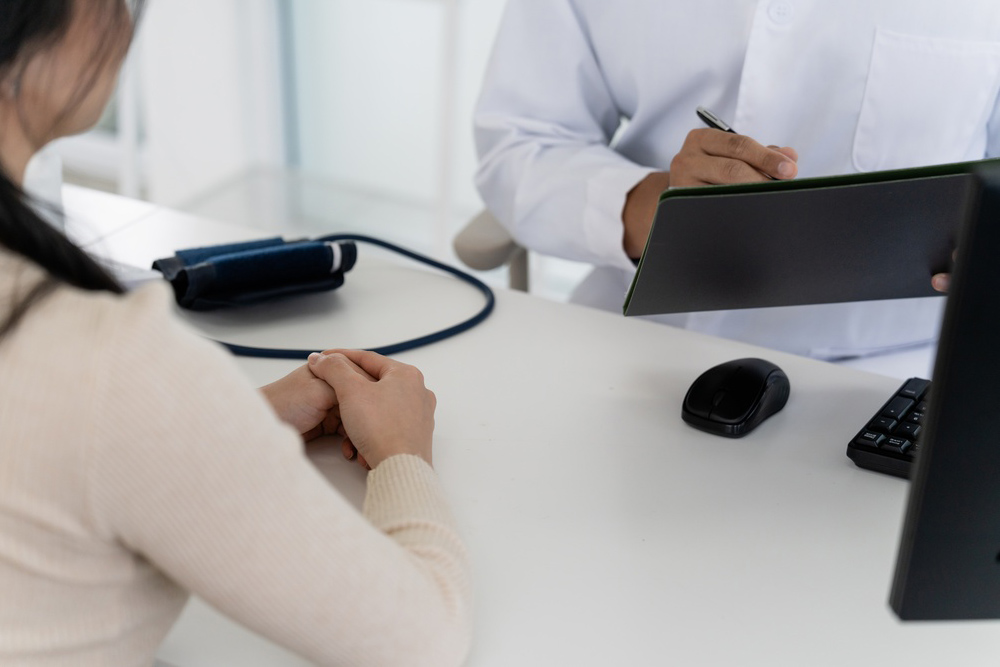 Healthcare provider discussing sleep disorder evaluation and treatment options with a patient experiencing poor sleep